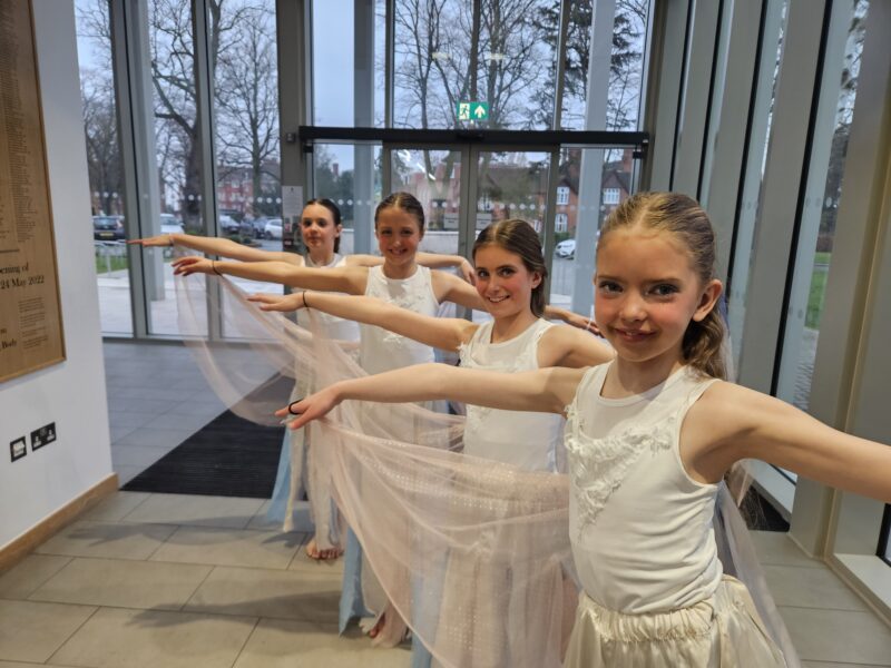 Four girls dancing in a ballet style