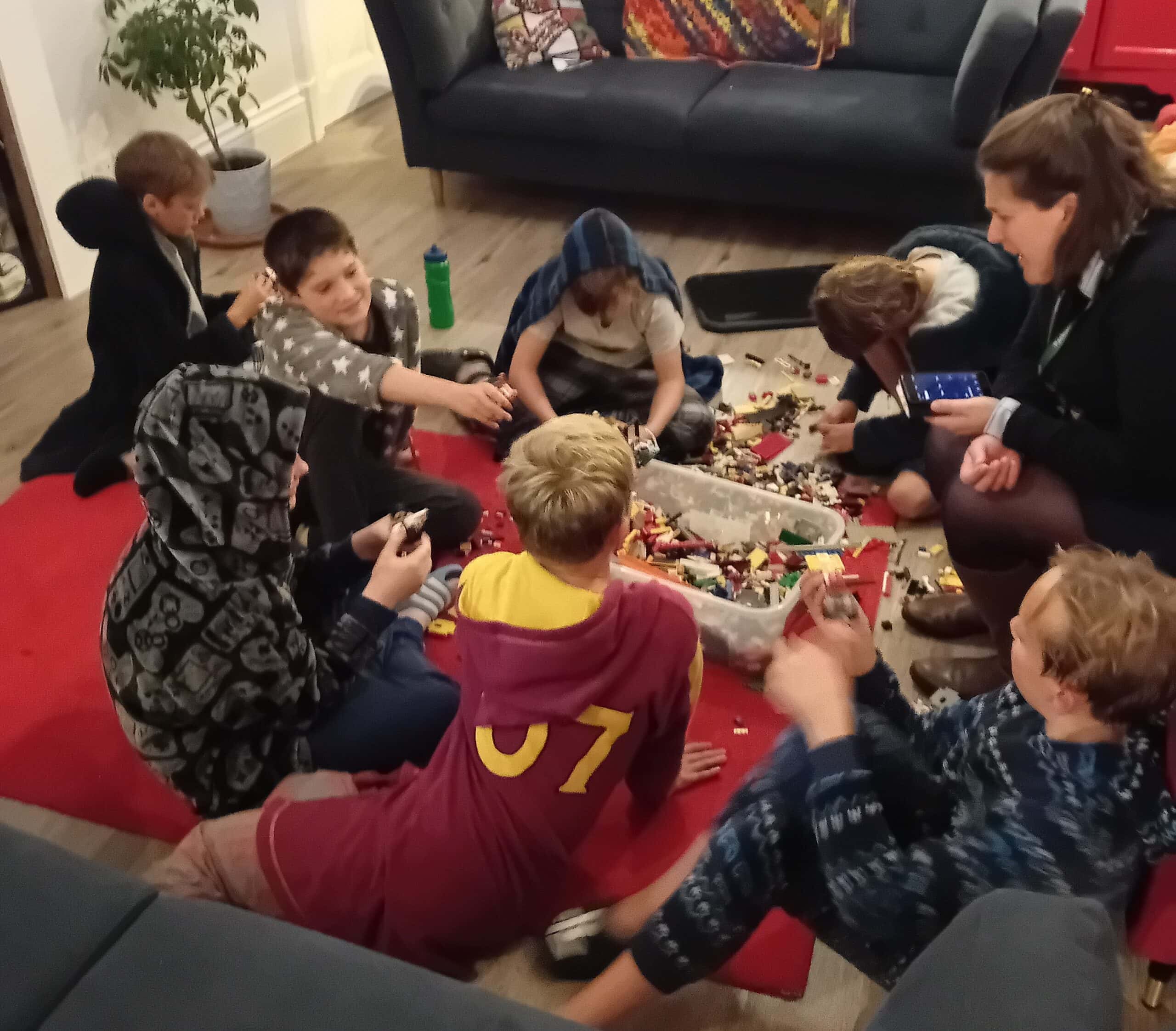 A group of boys playing lego