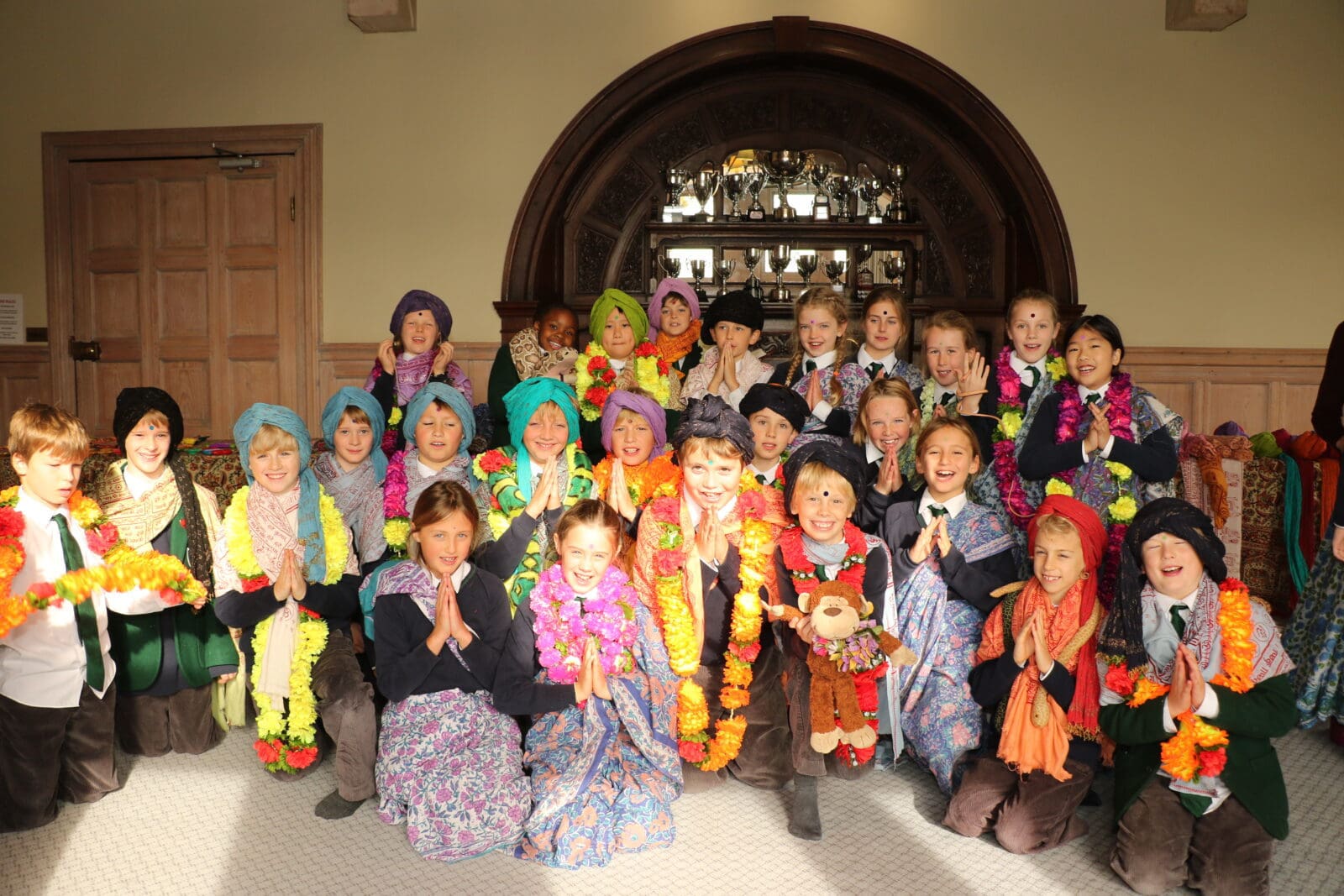 Group of school children enjoying Hindu workshop