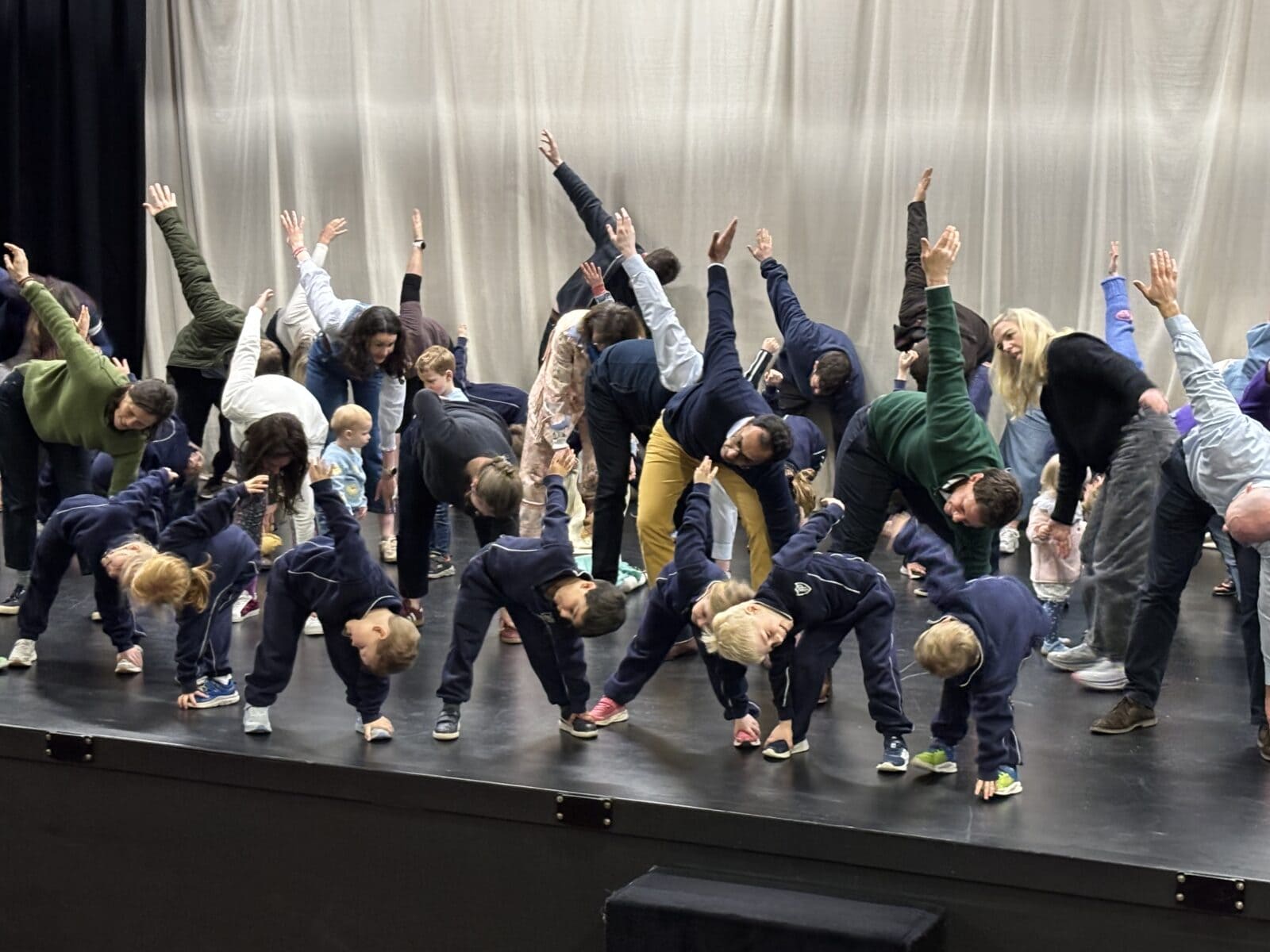 Children and parents on school stage