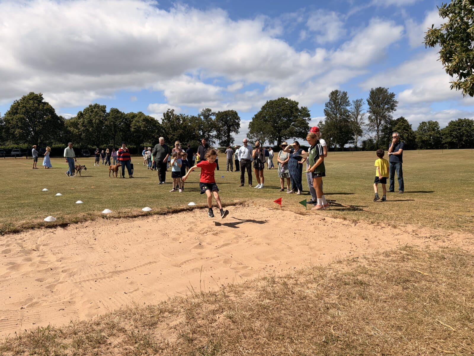 School sports day with girl doing the long jump
