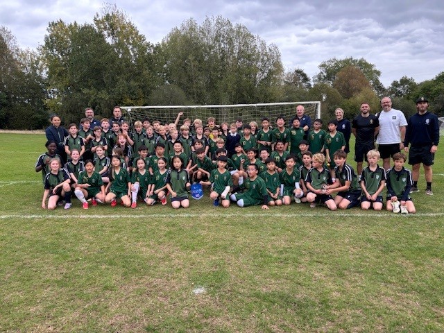 Group of school football teams on playing fields