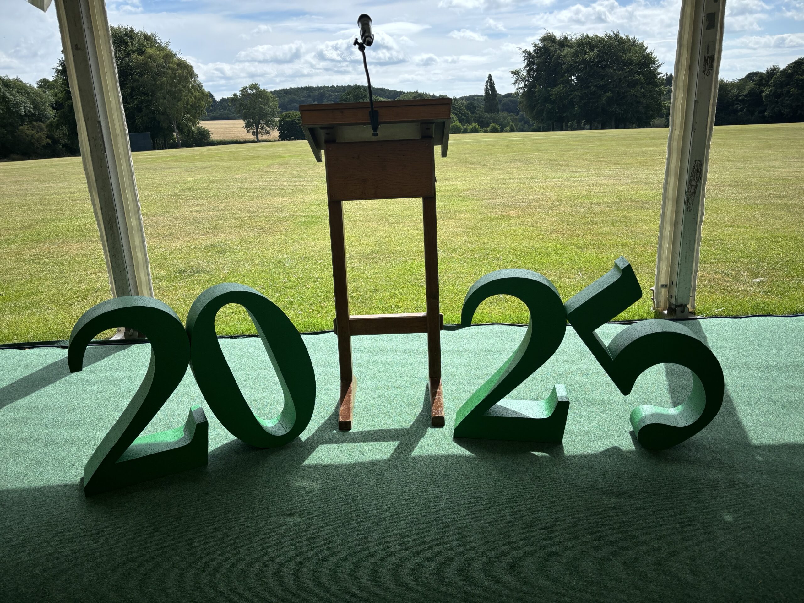 Picture of a 2025 sign and lectern