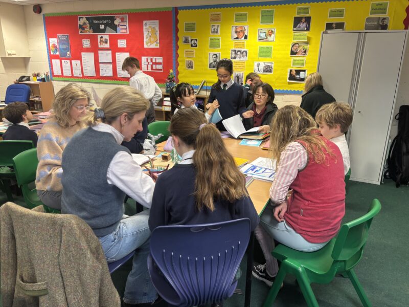 Parents and children reading together