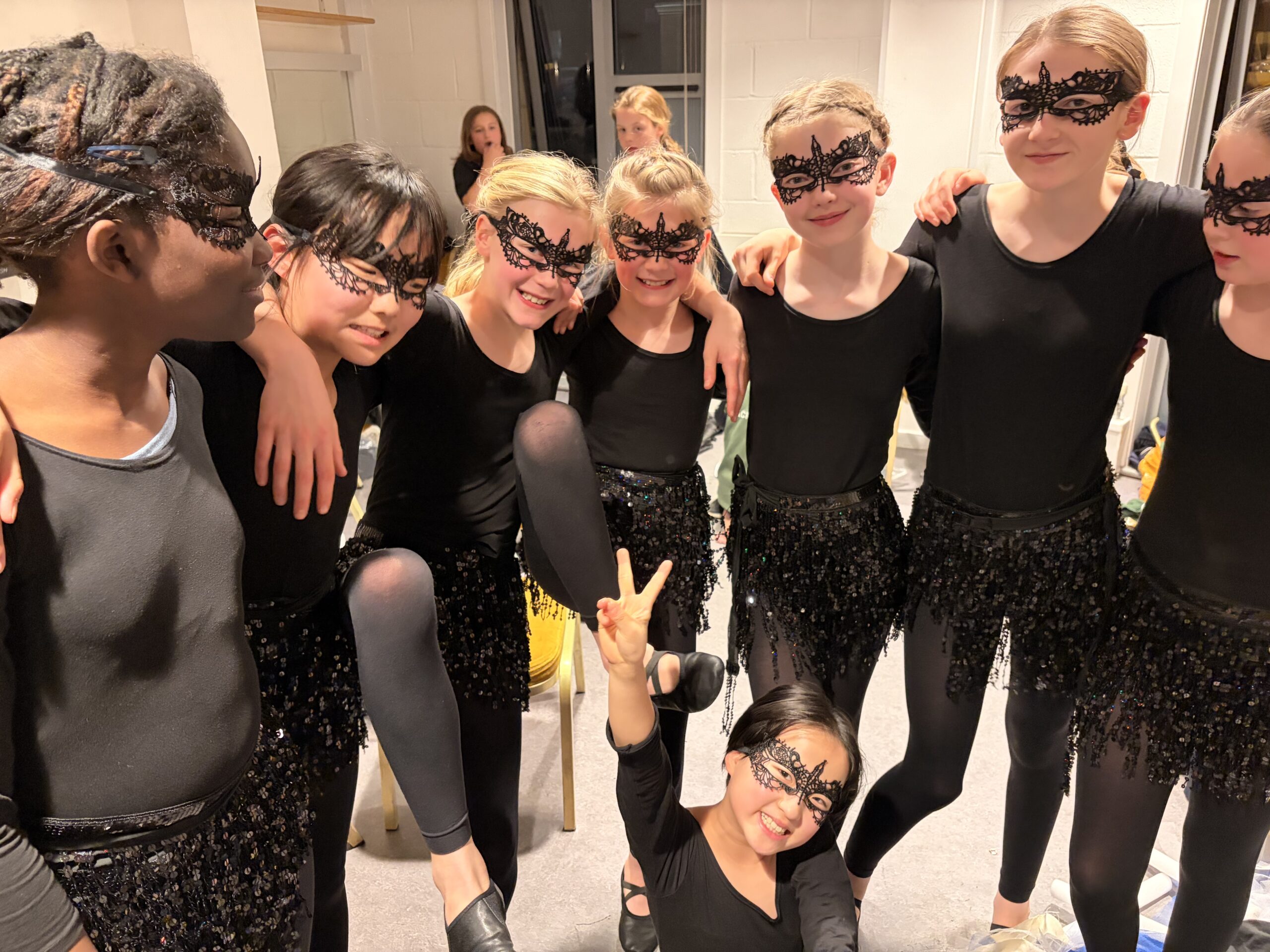 Pupils in dance costumes ready to perform
