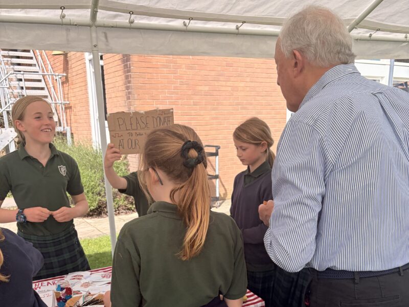 Pupils and their grandparents at a school stall