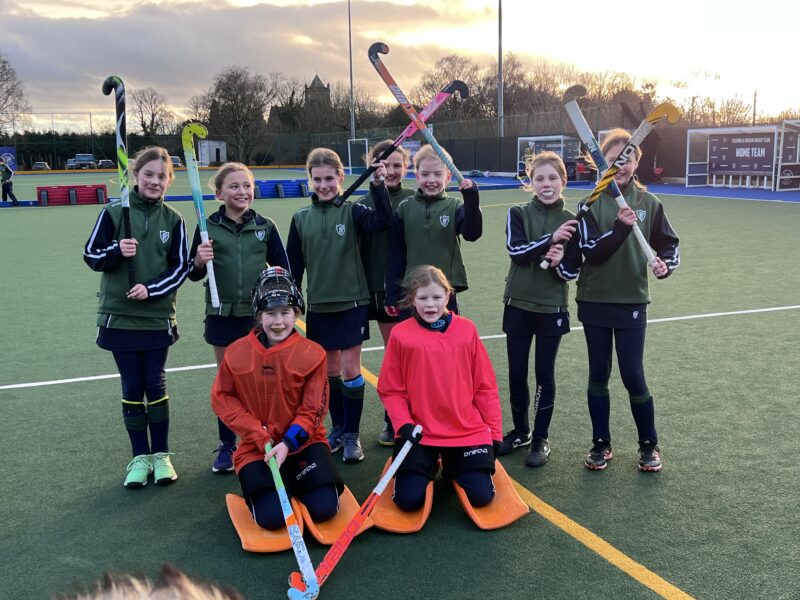 Girls hockey team celebrating a win