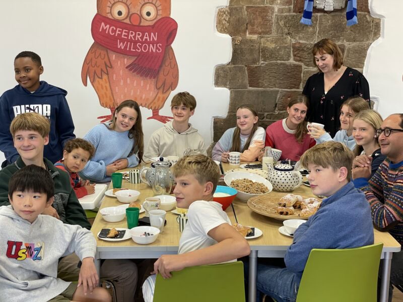 Packwood children in home clothes enjoying breakfast together
