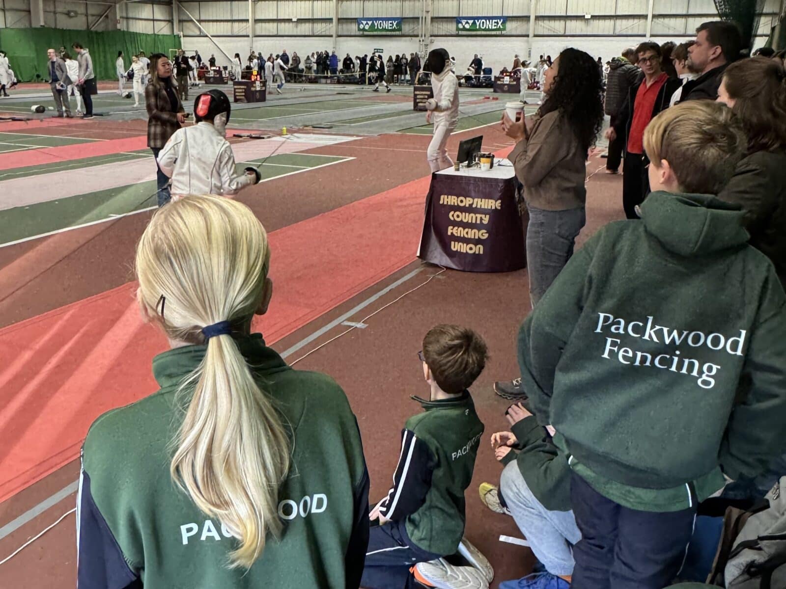 Pupils wearing Packwood School sports kit watching fencing