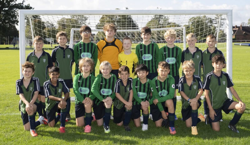 Packwood U11 and U13 boys' football teams in kit
