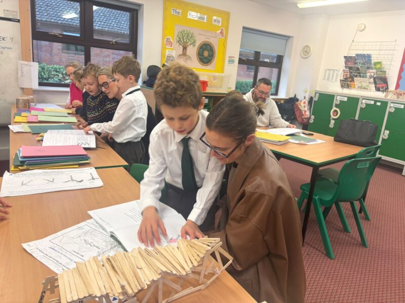 Parents with their children in a classroom