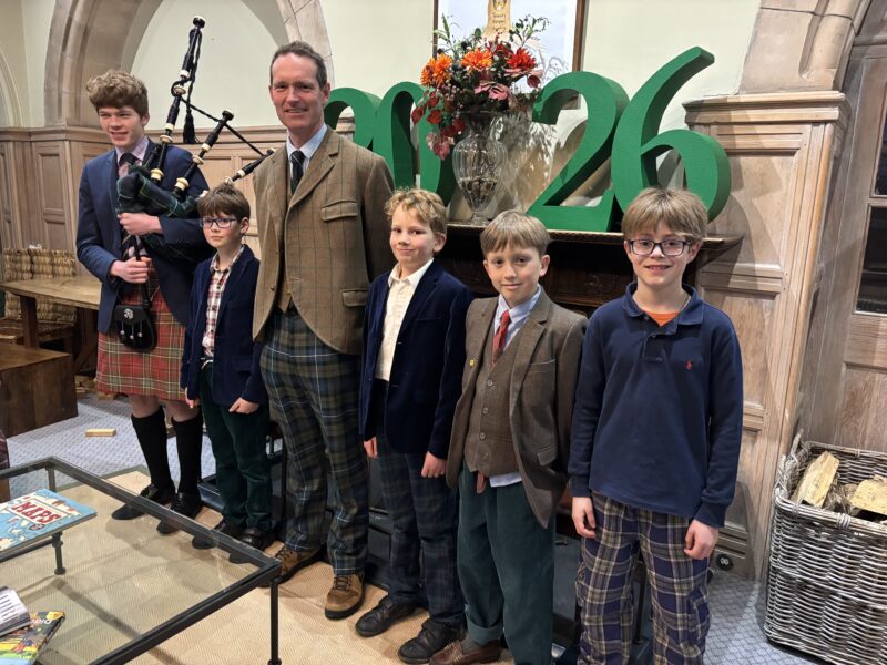 Group of school children dressed in traditional Scottish attire