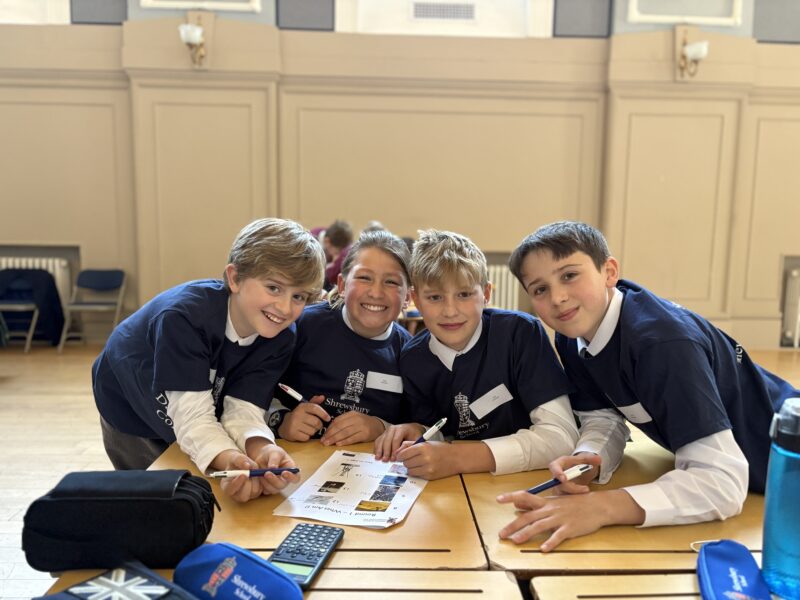 Four pupils sat at a science quiz table
