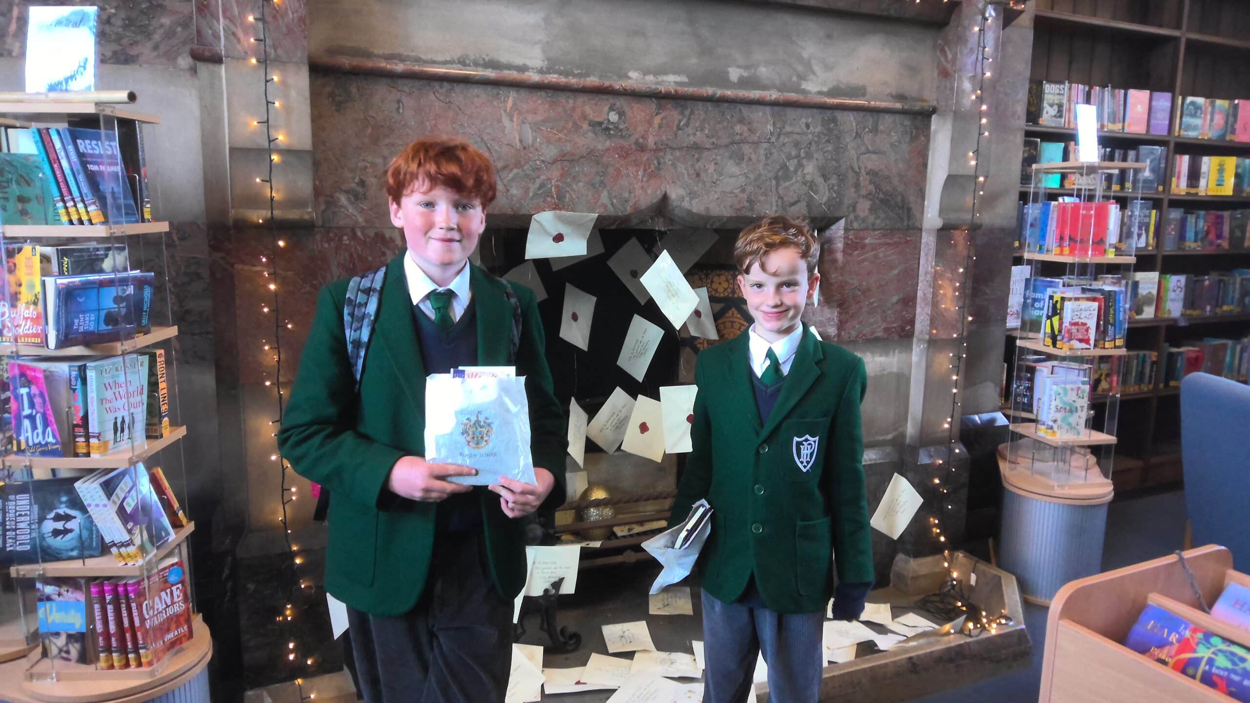 Pupils attending poetry event in library