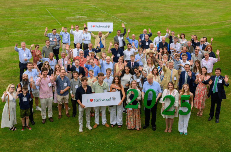 Group of people on lawn with I love Packwood sign