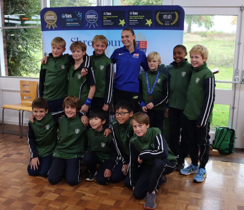 Team of cross country runners receiving medals