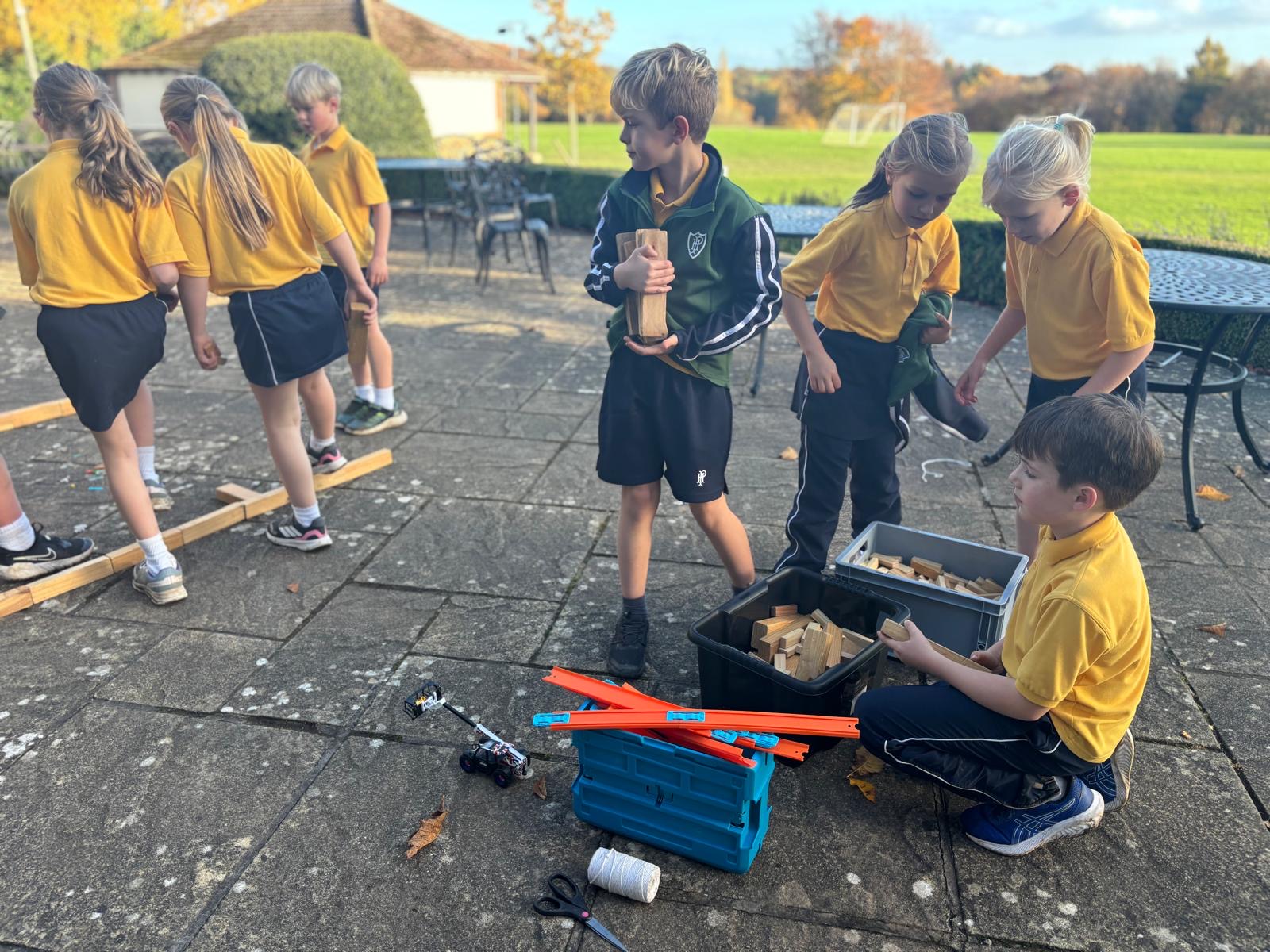 Group of children collaborating in outdoor team challenge