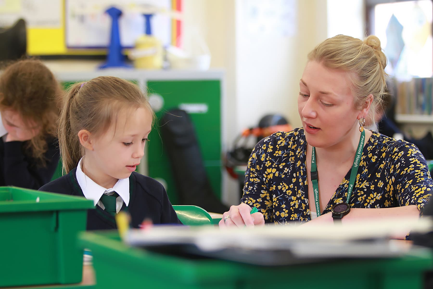 Teacher and pupil in classroom