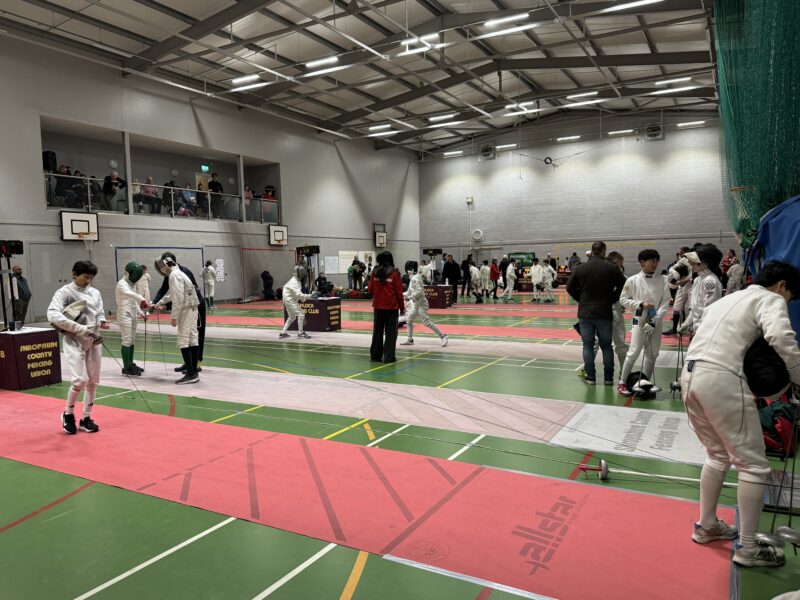 Fencing competition in a school sports hall