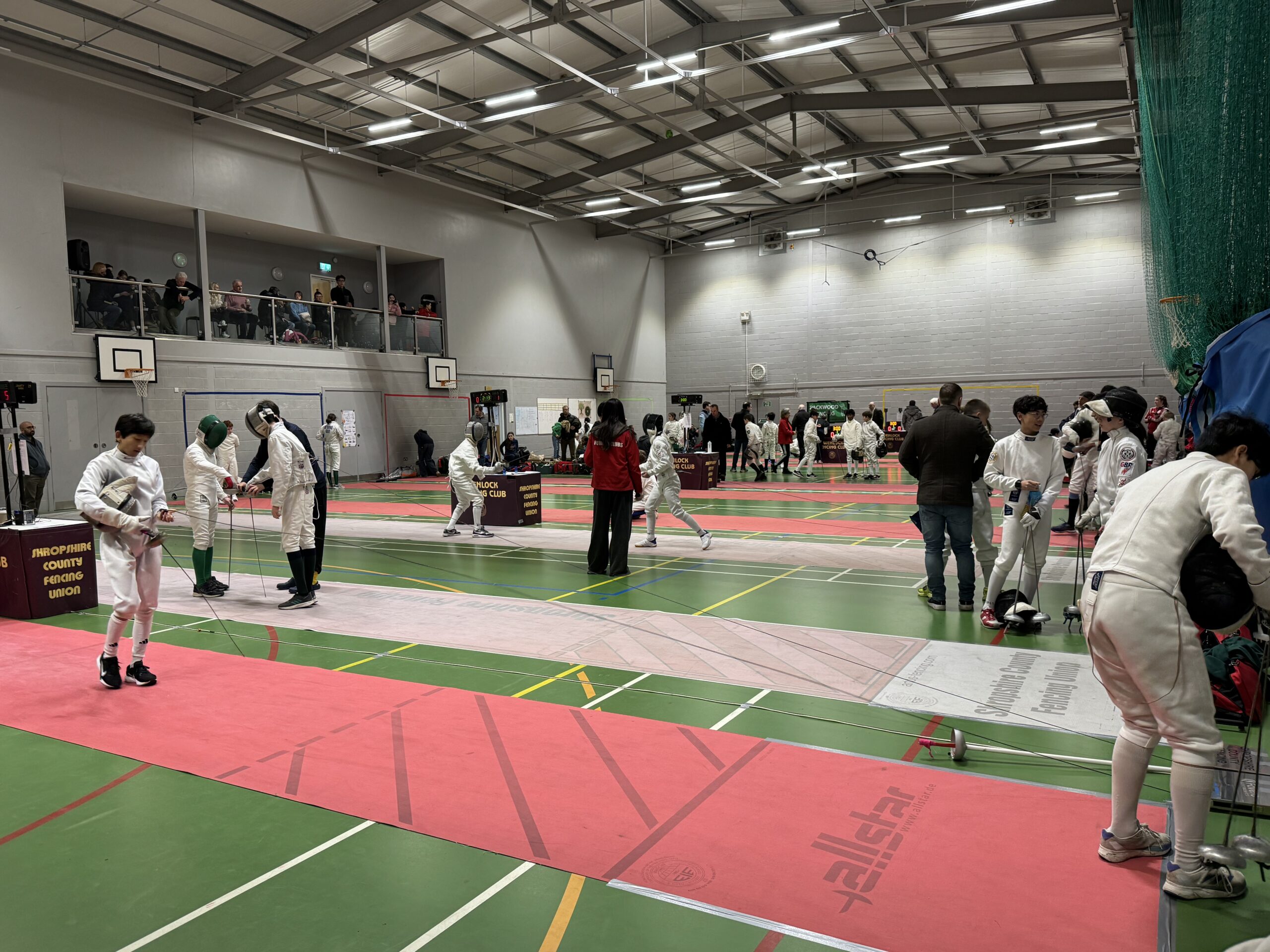 Fencing competition in a school sports hall