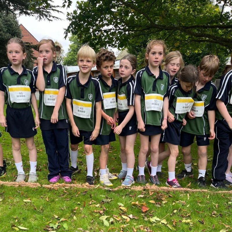 Group of young children on a cross country race start line