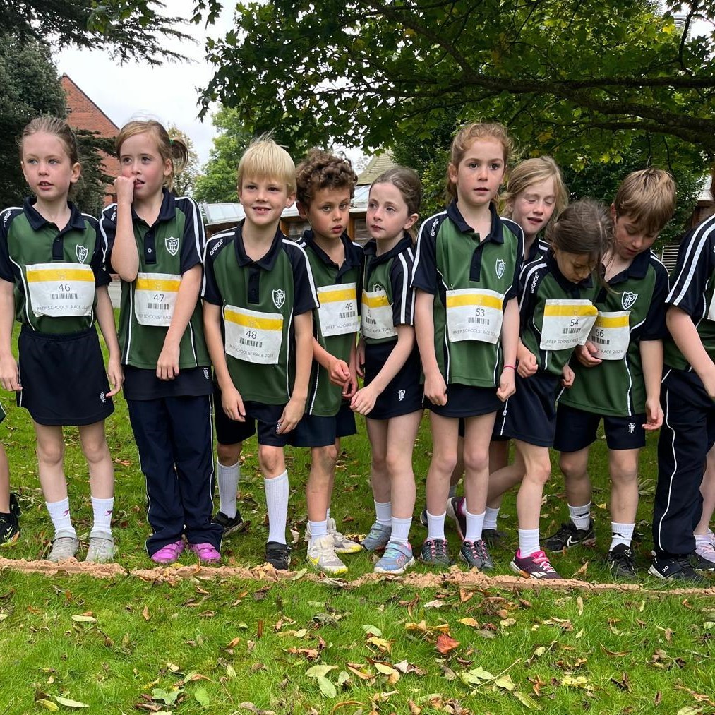 Group of young children on a cross country race start line