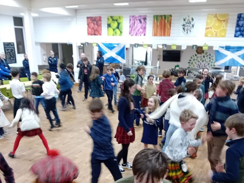 Children dancing in a school hall