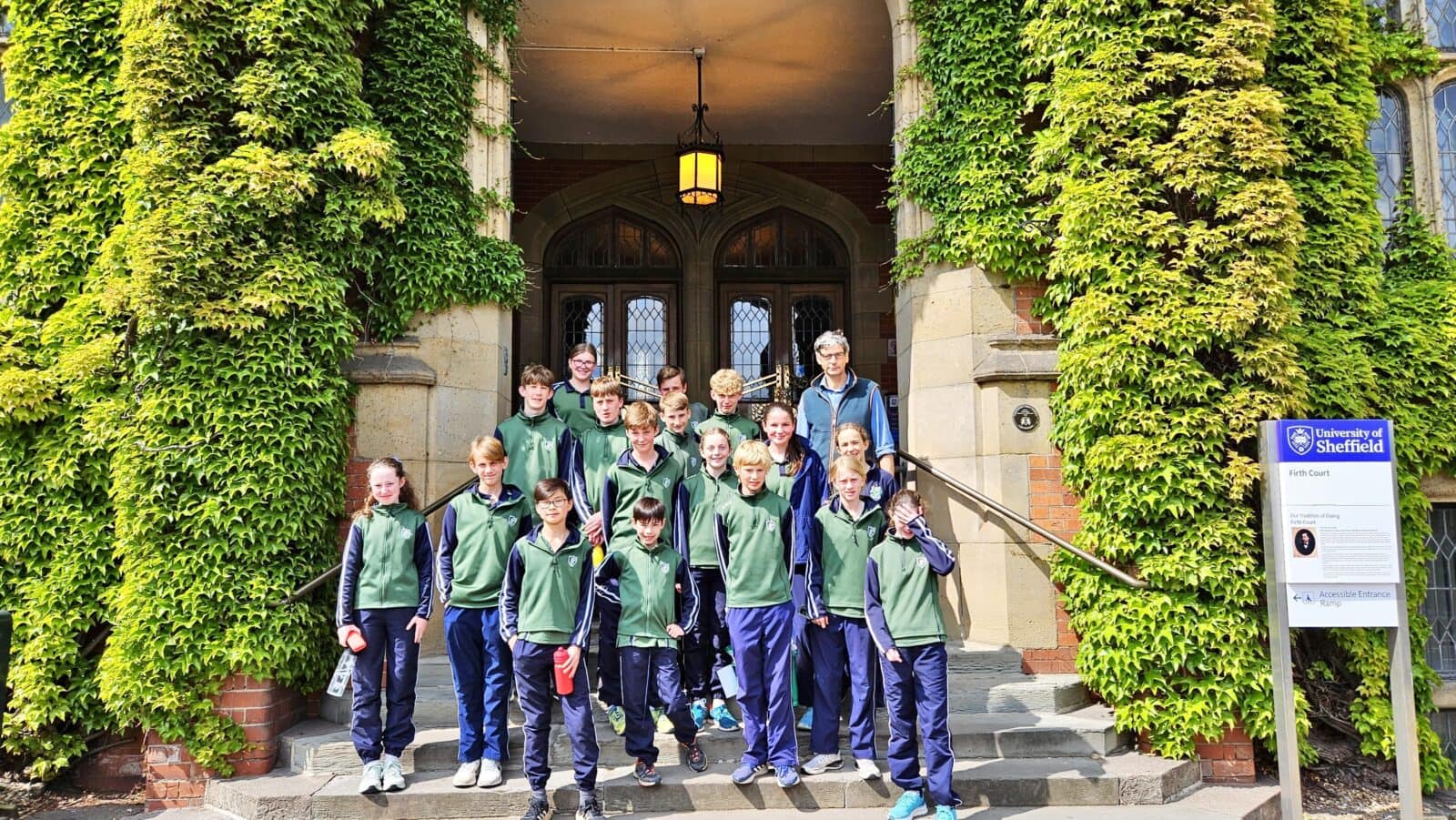 A group of Packwood Year 8 pupils standing outside the entrance to the University of Sheffield