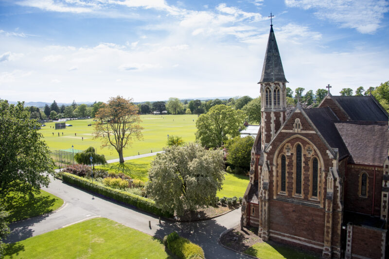 Cricket pitches in background with a beautiful chapel to the right