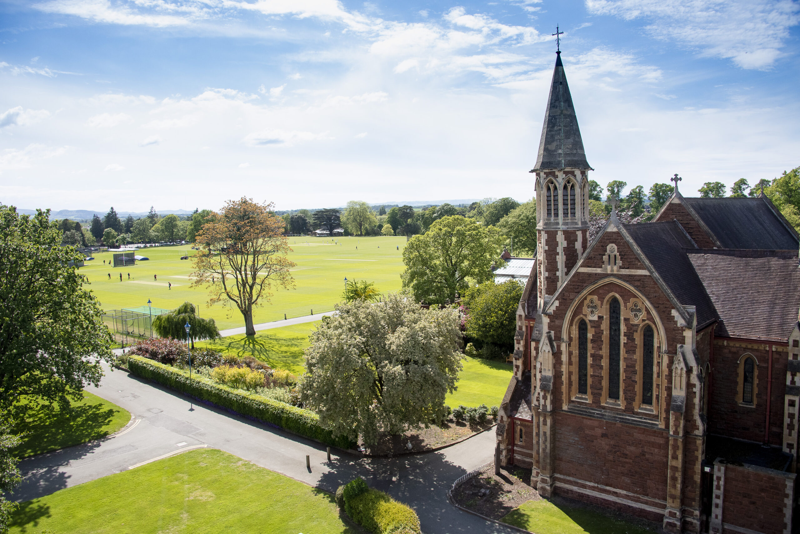 Cricket pitches in background with a beautiful chapel to the right